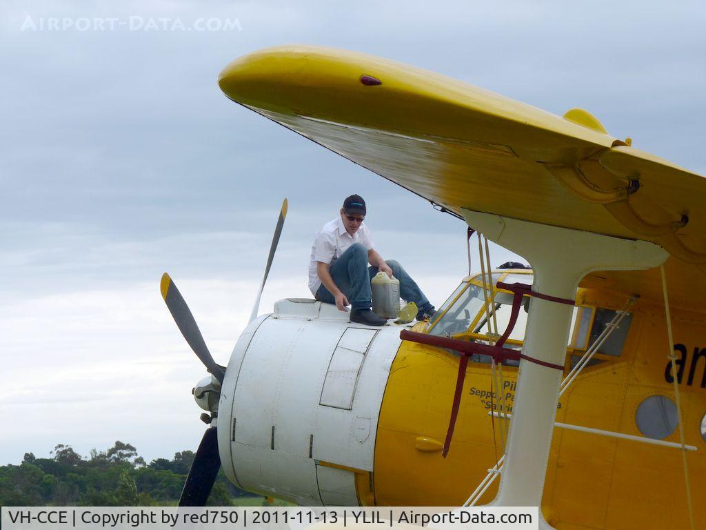 VH-CCE, 1989 Antonov An-2TP C/N 1G234-09, Topping up the engine oil. To reach the filler, you climb steps in the port side of the plane, walk up the spine of the fuselage, and climb over the cockpit. Note the walkway on the previous photo.
