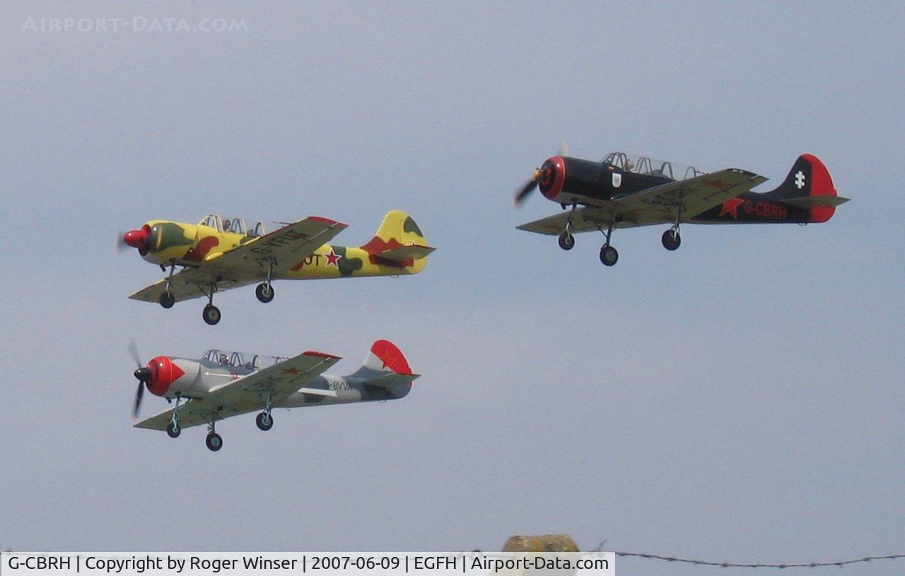 G-CBRH, 1984 Yakovlev Yak-52 C/N 844815, G-CBRH in formation take off with G-YFUT and G-BVVA.