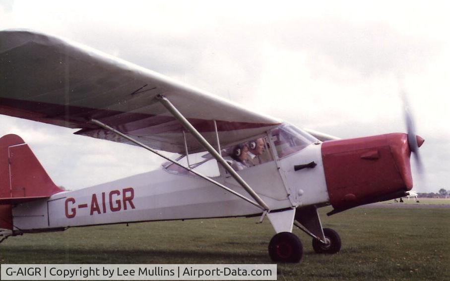 G-AIGR, 1946 Auster J-1N Alpha C/N 2172, G-AIGR departing Cranfield with Tim Merrett at the controls and passenger Caroline Mullins. C1984.