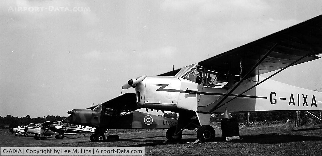 G-AIXA, 1942 Taylorcraft Auster 1 C/N 134, G-AIXA at the end of a line up of Austers at Castle Mill airstrip, Bedford. C1984. It ended up strung up in the RAF Museum, Hendon.