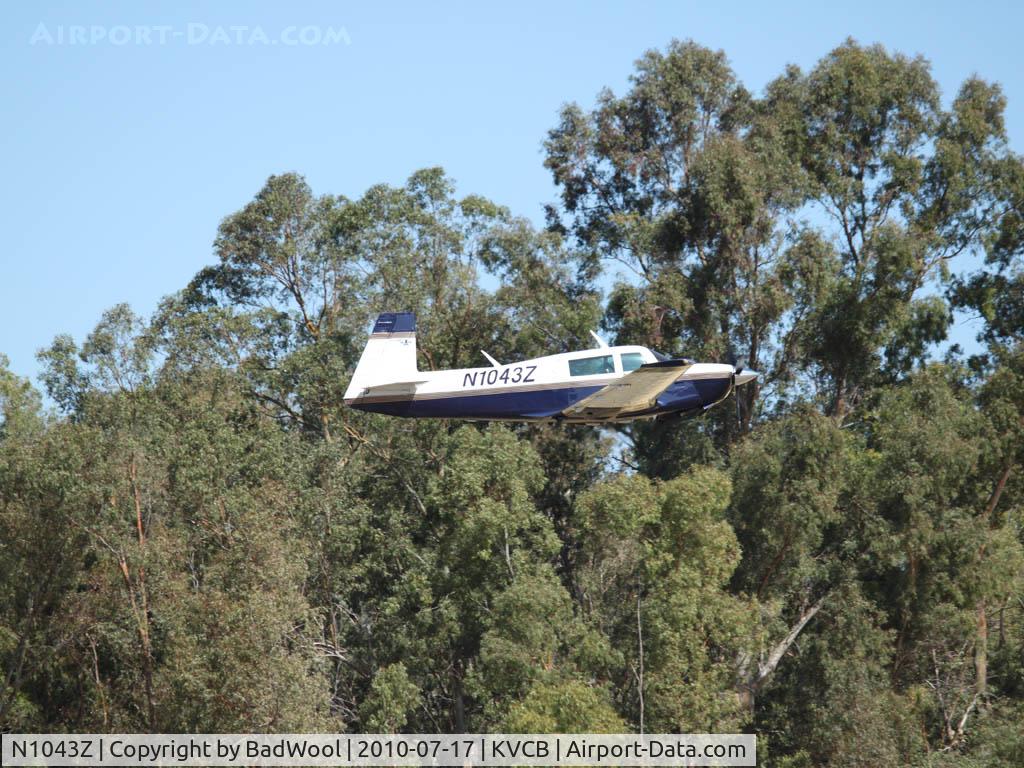 N1043Z, 1982 Mooney M20J 201 C/N 24-1337, Low level pass over the runway at Nut Tree airport.