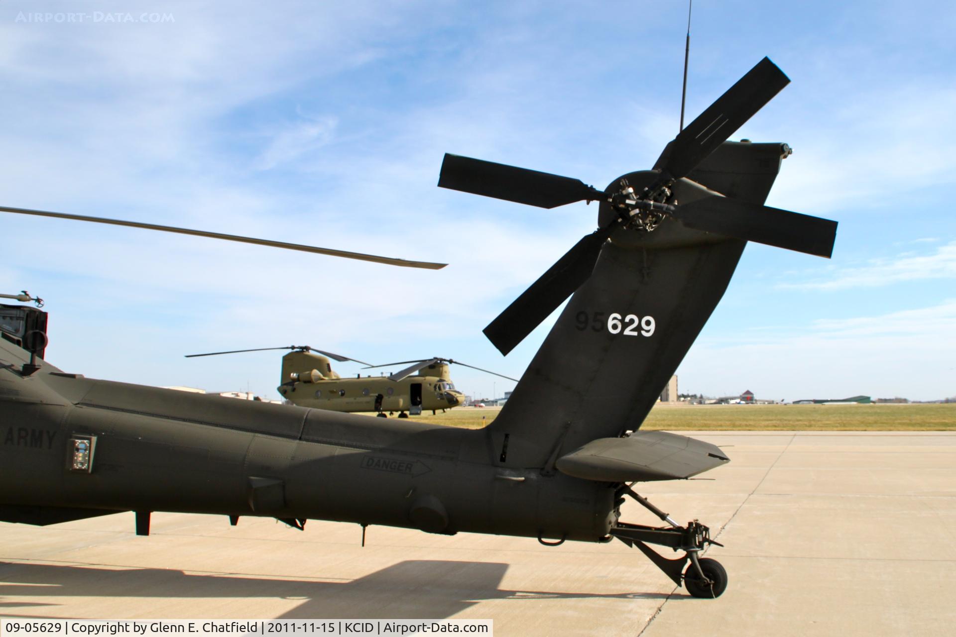 09-05629, 2011 Boeing AH-64D Apache C/N PVD629, Parked on the PS Air ramp.  Refueling stop on the way from Pennsylvania to Utah.  Behind is support aircraft, CH-47F 08-08762.