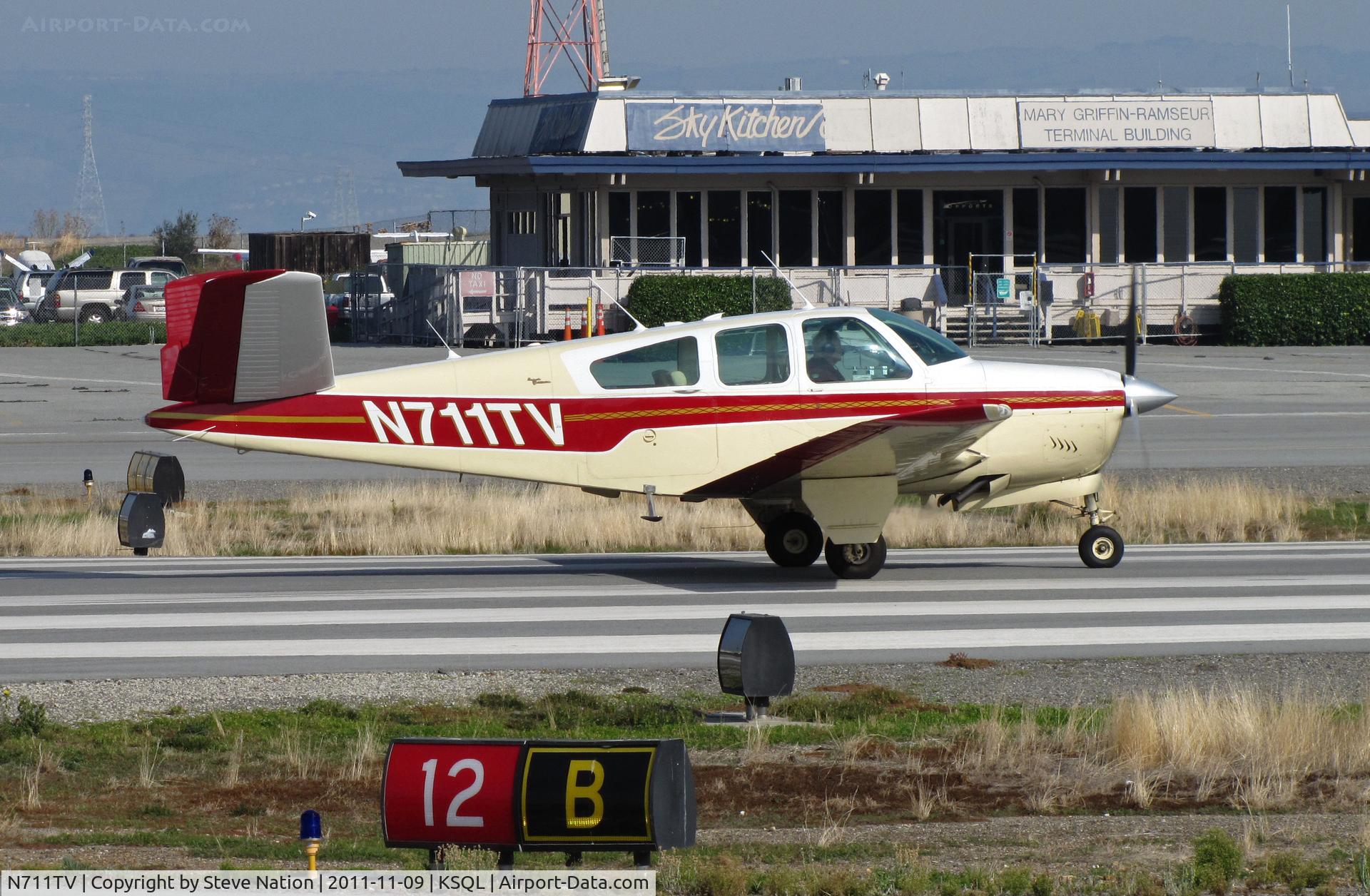 N711TV, 1965 Beech S35 Bonanza C/N D-7931, Locally-based 1965 Beech S35 Bonanza rolling at San Carlos, CA