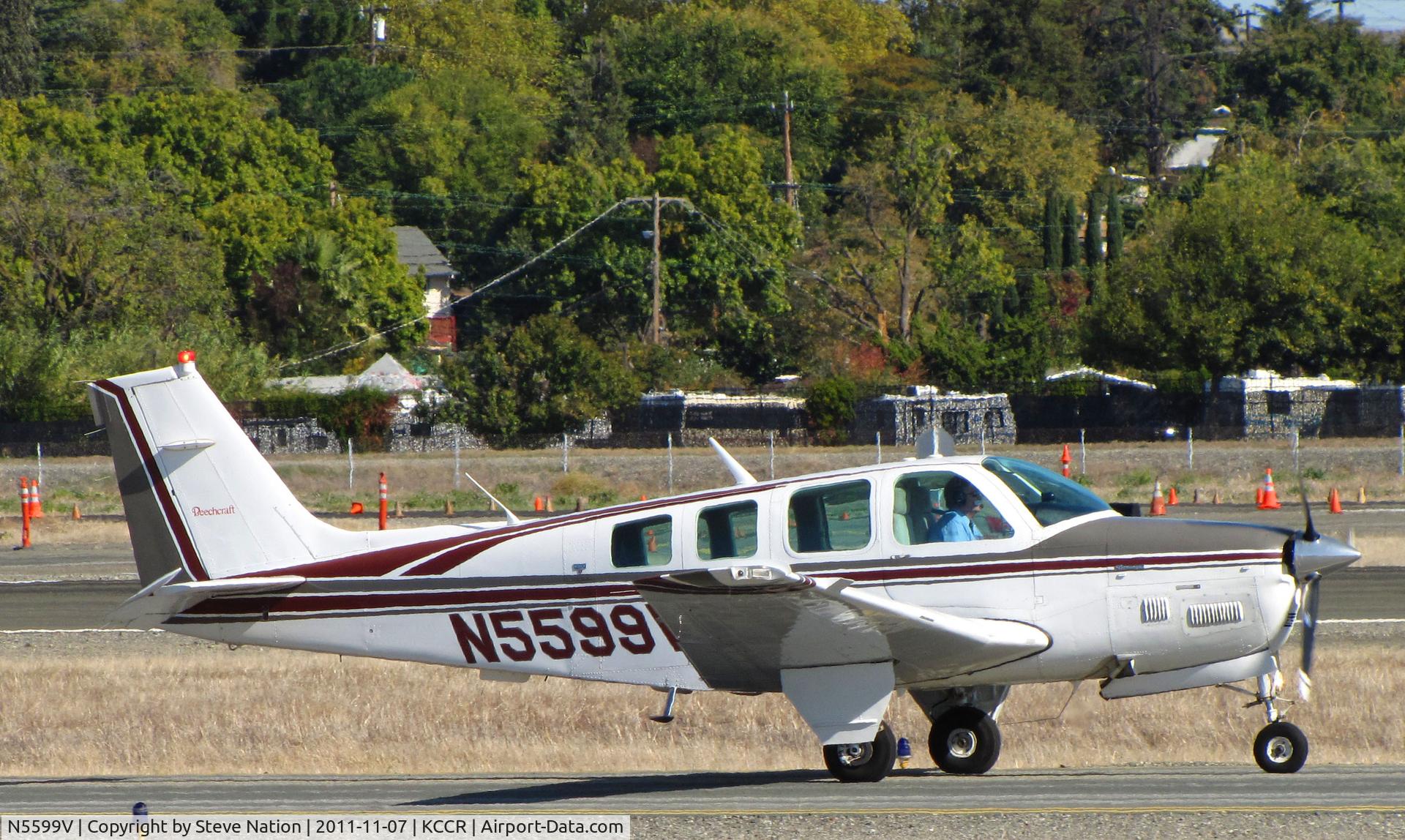 N5599V, 1989 Beech B36TC Bonanza C/N EA-500, 1989 Beech B36TC taxiing for take-off on RWY 32R at Buchanan Field