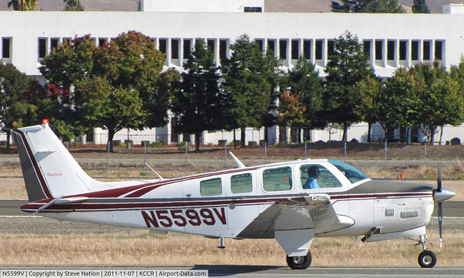 N5599V, 1989 Beech B36TC Bonanza C/N EA-500, 1989 Beech B36TC taxiing for take-off on RWY 32R at Buchanan Field