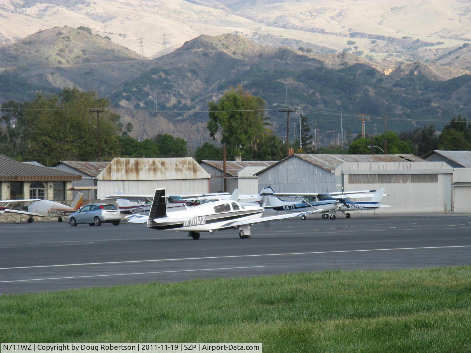 N711WZ, 1990 Mooney M20M Bravo C/N 27-0042, 1990 Mooney M20M Turbo BRAVO, Lycoming TIO-540-AF1A 270 Hp, taxi to Rwy 22, that's snow in the higher mountains