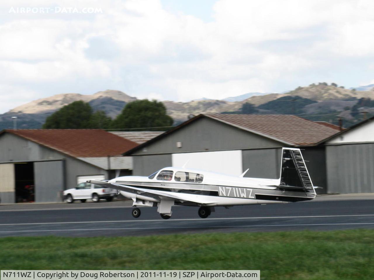 N711WZ, 1990 Mooney M20M Bravo C/N 27-0042, 1990 Mooney M20M TLS Turbo BRAVO, Lycoming TIO-540-AF1A 270 Hp, takeoff Rwy 22. Mooney built 49 of these in 1990.