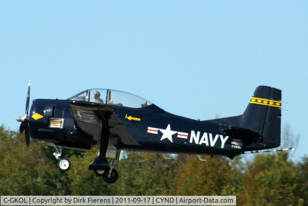 C-GKOL, 1957 North American T-28C Trojan C/N 252-23, Leaving the rwy for a flight demo.