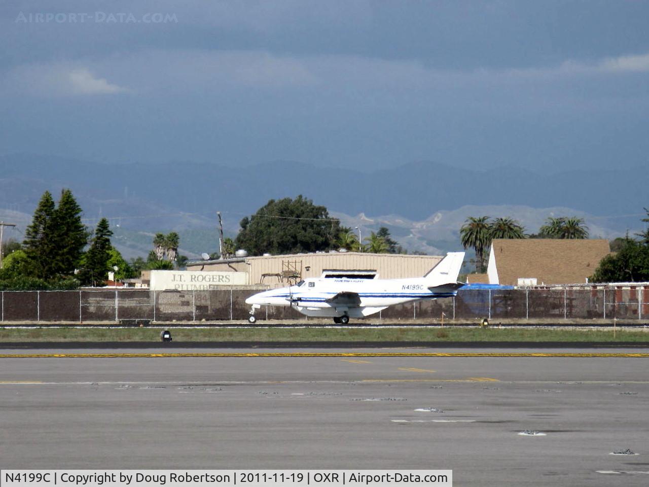 N4199C, 1968 Beech 99 C/N U-50, 1968 Beech 99 c/n U-50 modified to prototype C99 AIRLINER in 1980, two UACL PT6A-36 turboprops 715 shp each, with further modifications, note ventral pannier, holding on Rwy 25