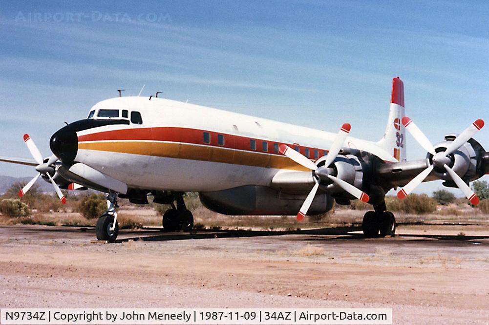 N9734Z, 1957 Douglas DC-7C Seven Seas Seven Seas C/N 45215, T&G Aviation - Chandler Memorial Airport, 1987
