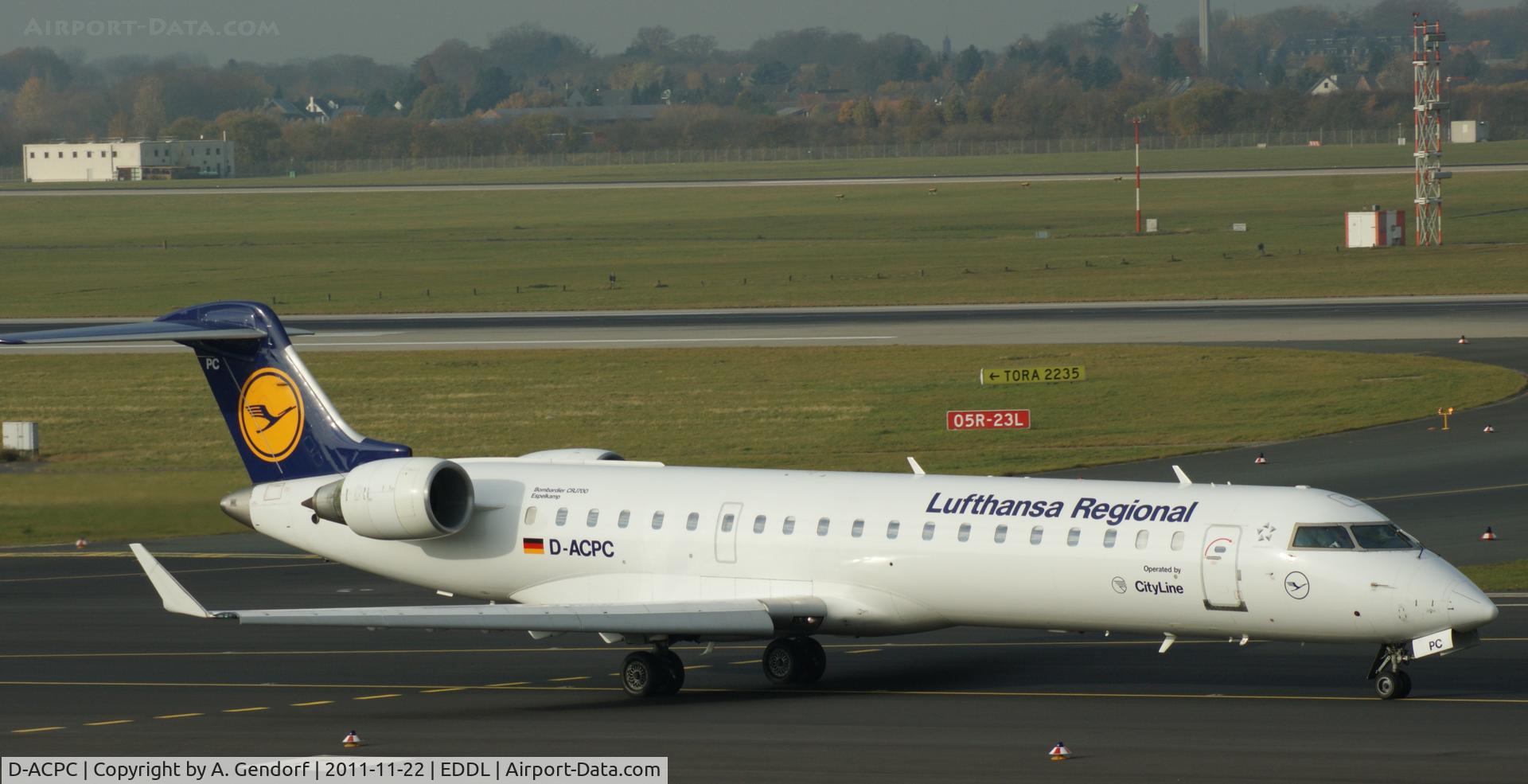 D-ACPC, 2001 Canadair CRJ-701ER (CL-600-2C10) Regional Jet C/N 10014, Lufthansa CityLine (Regional), CRJ 700 is taxiing for departure at Düsseldorf Int´l (EDDL)