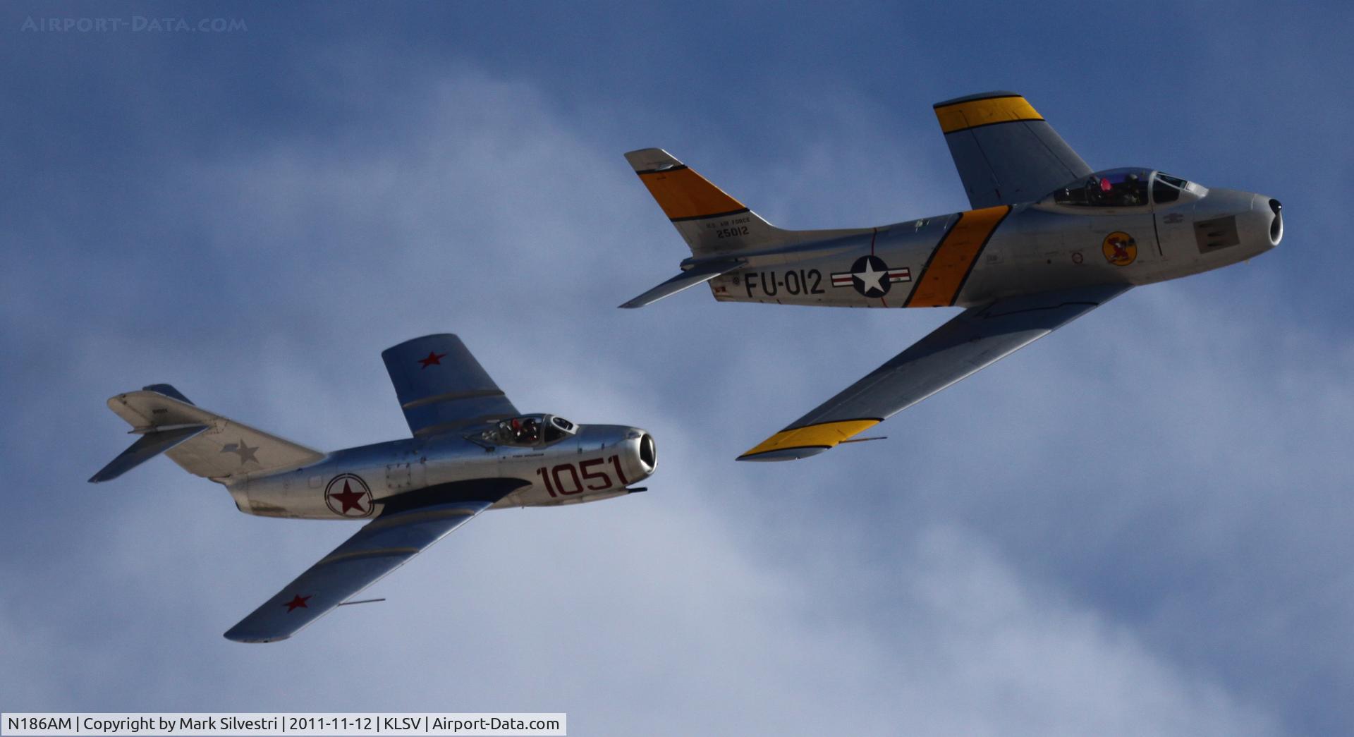 N186AM, 1952 North American F-86F Sabre C/N 191-708, Aviation Nation 2011
F-86 w/MiG-15 (NX87CN, 910-51)