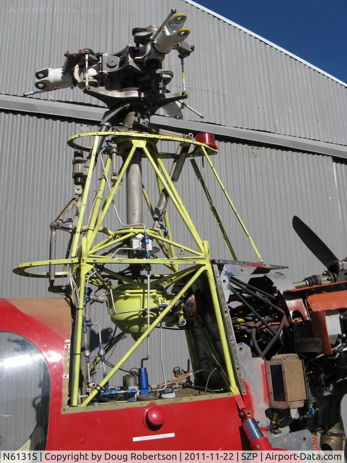 N6131S, 1965 Air & Space America Inc 18A C/N 18-38, 1965 Air & Space Mfg. Inc. 18A jump start autogyro, Lycoming O&VO-360 180 Hp pusher engine, rotor hub and control linkages with cowls off, (Rube Goldberg lives here)