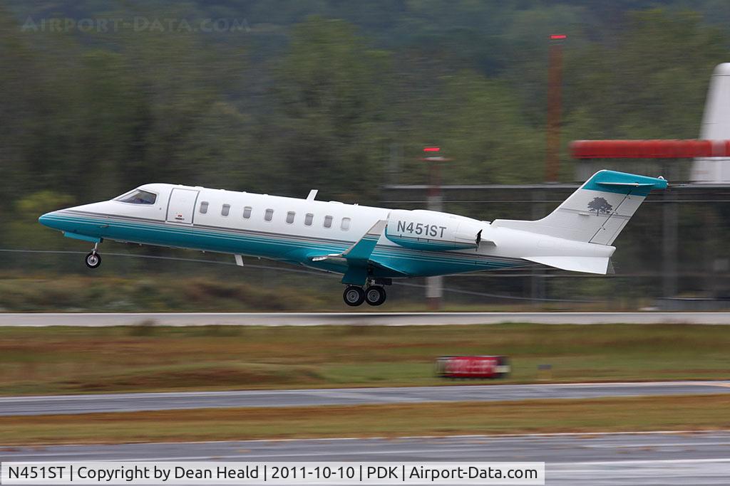 N451ST, 2002 Learjet 45 C/N 200, JM Aviation's 2002 Bombardier Learjet 45 N451ST departing RWY 2R in rainy conditions.