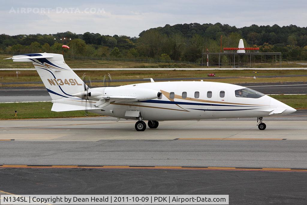 N134SL, Piaggio P-180 C/N 1100, Avantair Piaggio P180 Avanti N134SL taxiing to RWY 2R for departure to Jacksonville Int'l (KJAX). The friendly crew can be see waving to me as they taxi by.
