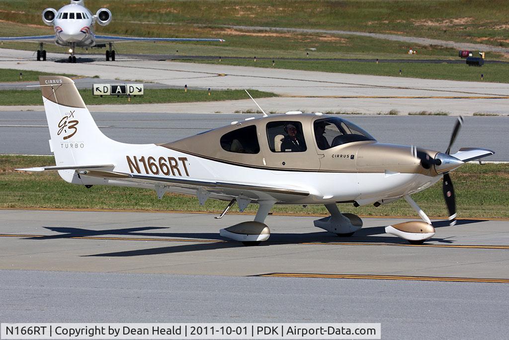 N166RT, 2007 Cirrus SR22 G3 GTS Turbo C/N 2687, TBA Aviation LLC's 2007 Cirrus SR22 GTSx G3 Turbo N166RT taxiing to RWY 2L for departure. Little did they know that Taylor Swift was in the Falcon in the background arriving for her 