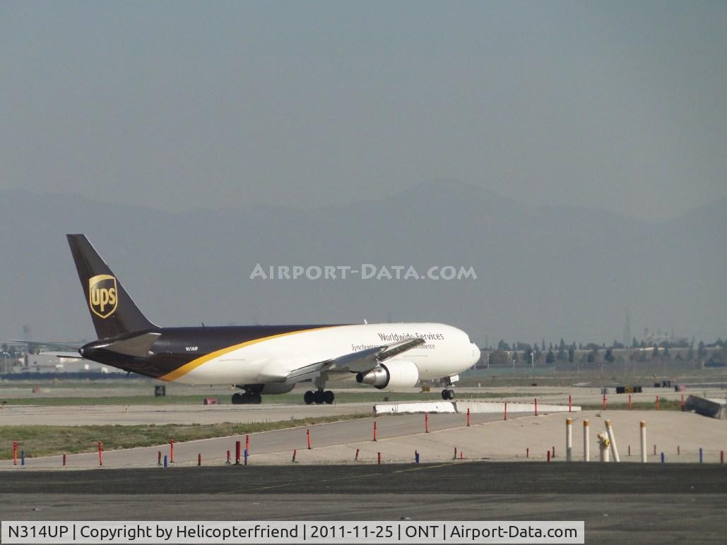 N314UP, 1996 Boeing 767-34AF C/N 27742, Just turned off of runway 26L and is taxiing eastbound to UPS area via taxiway Sierra