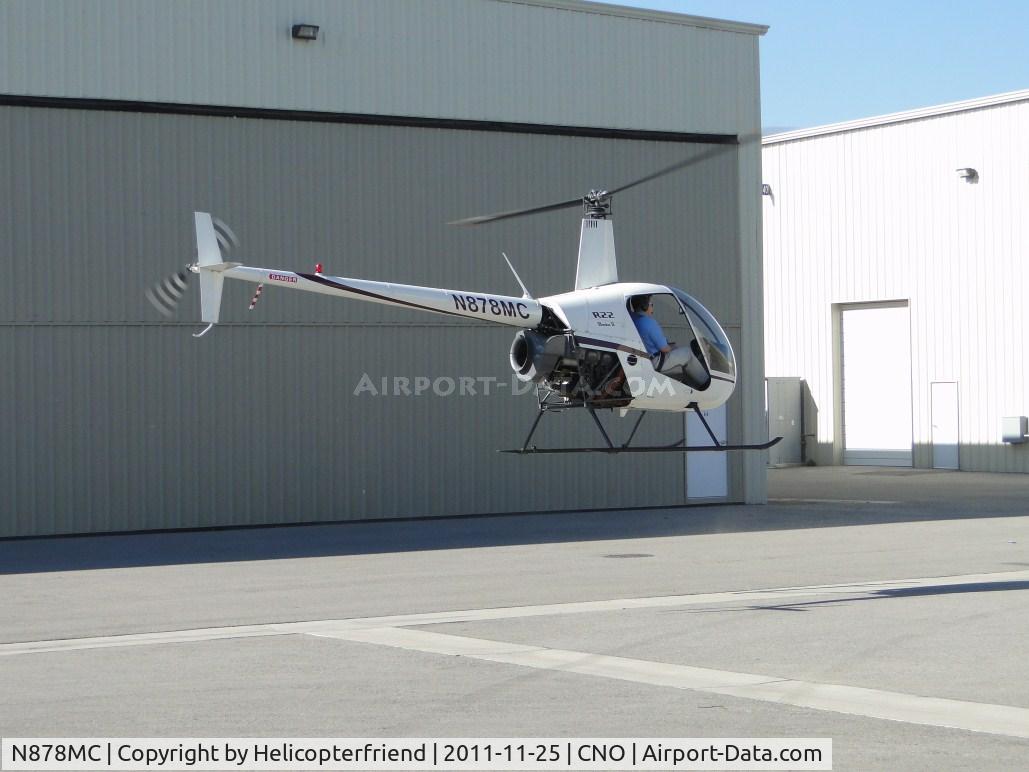 N878MC, 2005 Robinson R22 Beta C/N 3782, Air Taxiing and getting ready to turn westbound at the end of the hanger row