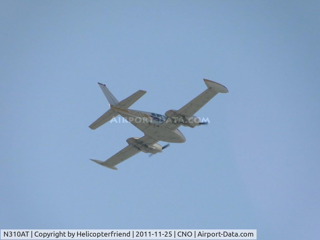 N310AT, 1965 Cessna 310J C/N 310J0097, High pass over the runway and turning southbound