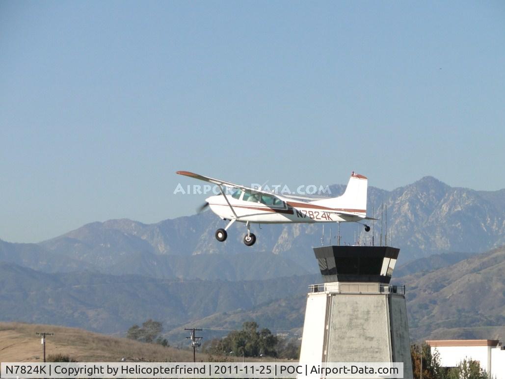 N7824K, 1976 Cessna 180J C/N 18052758, Passing the control tower and heading west