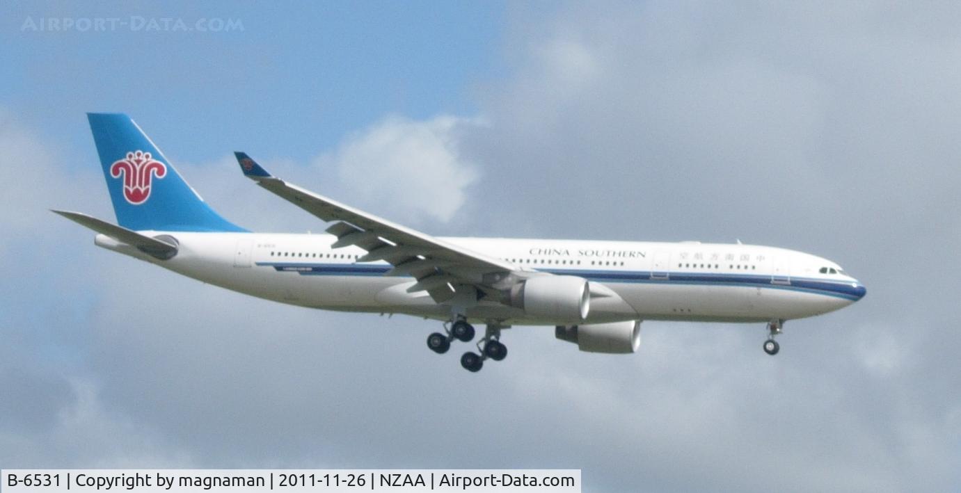 B-6531, 2011 Airbus A330-223 C/N 1233, ON final approach to Auckland. So easy to photo here from viewing area. Taken by my 7 yr old son with simple point and shoot old digi camera - no zoom.