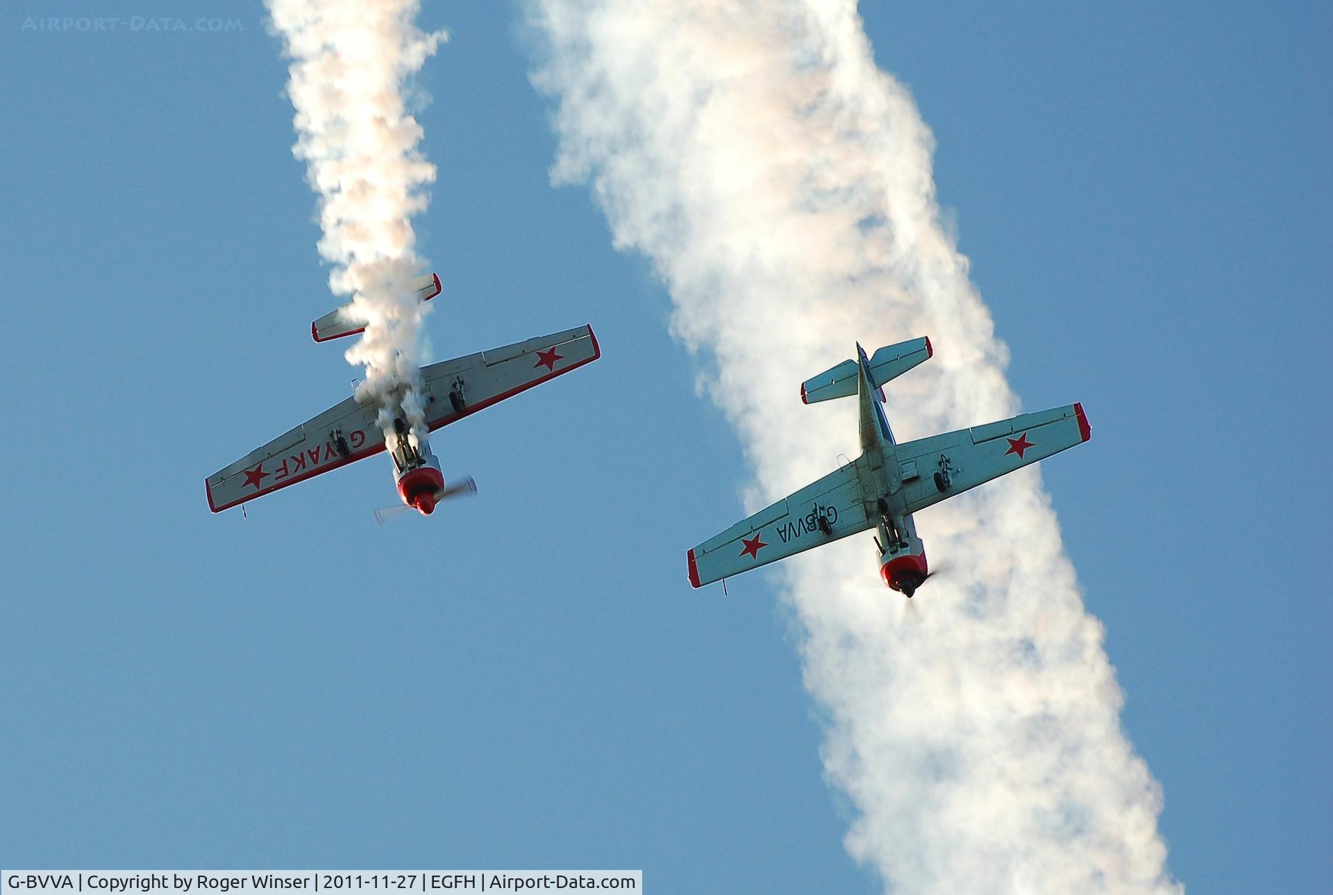 G-BVVA, 1987 Bacau Yak-52 C/N 877610, Leading G-YAKF in formation aerobatic practice. G-BVVA was re-registered as G-YAKE on 4th May 2012.