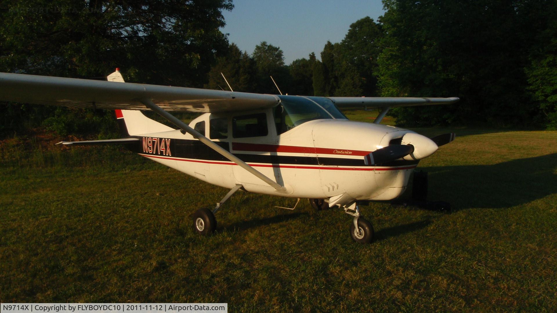 N9714X, 1962 Cessna 210B C/N 21058014, Cessna 210B on turf.
