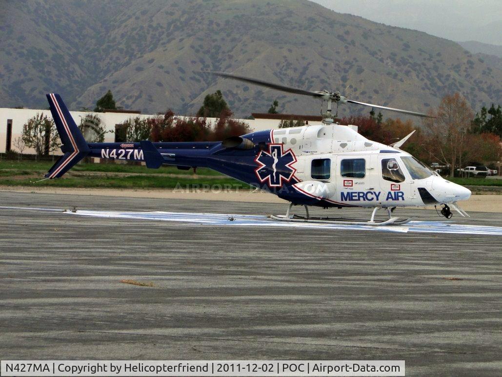 N427MA, 1987 Bell 222UT C/N 47558, Setting on the compass area south of runway 26L