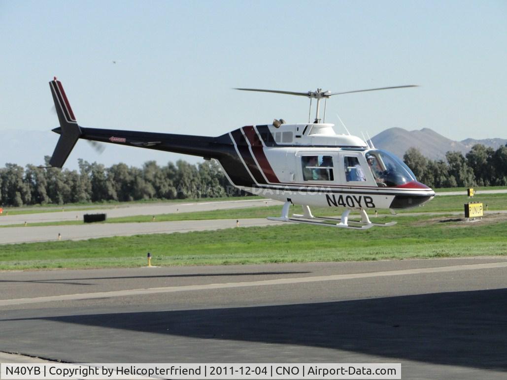N40YB, Bell 206B C/N 2787, Lifting off to air taxi to runway 26L for take off