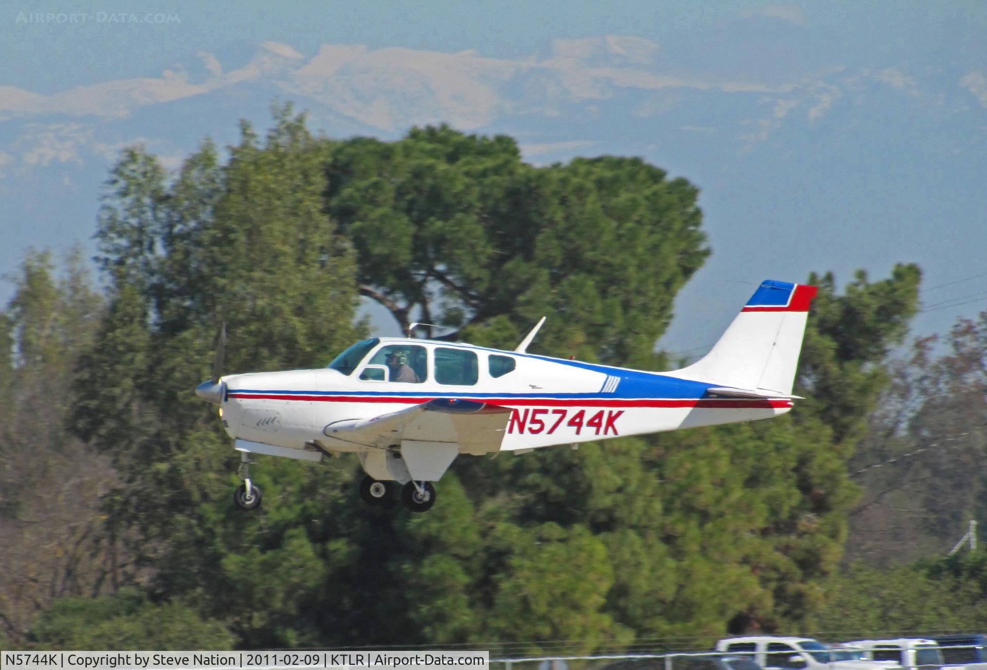 N5744K, 1964 Beech 35-B33 Debonair C/N CD-790, Southern California-based 1964 Beech 35-B33 Bonanza climbing out from Tulare, CA