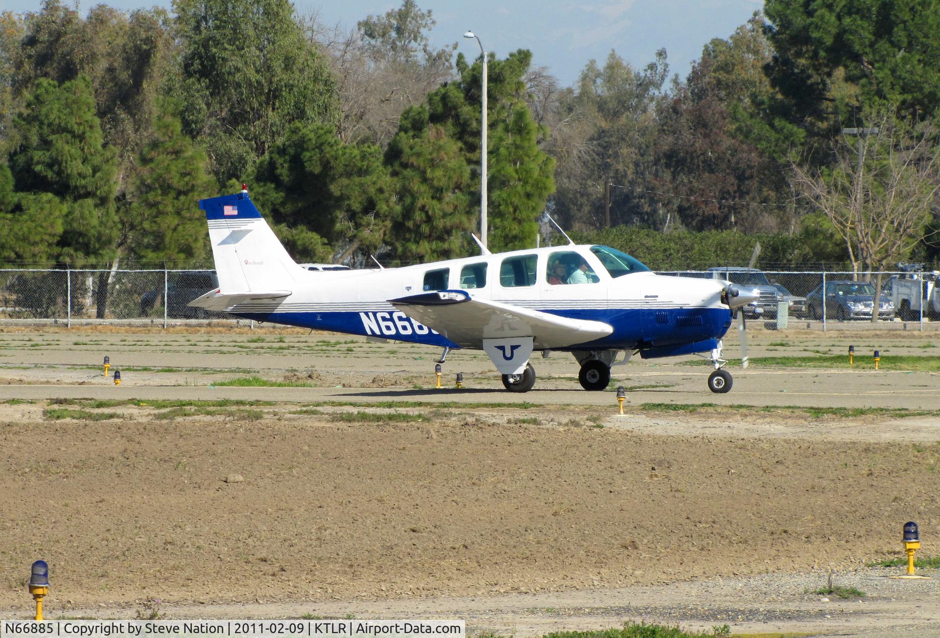 N66885, 1979 Beech A36TC Bonanza 36 C/N EA-48, Marysville, CA-based 1979 Beech A36TC taxis in @ Tulare, CA for International Ag Expo