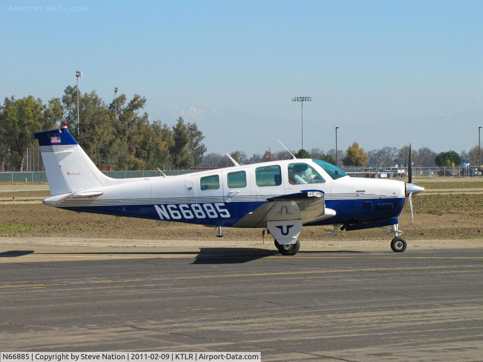 N66885, 1979 Beech A36TC Bonanza 36 C/N EA-48, Marysville, CA-based 1979 Beech A36TC taxis in @ Tulare, CA for International Ag Expo