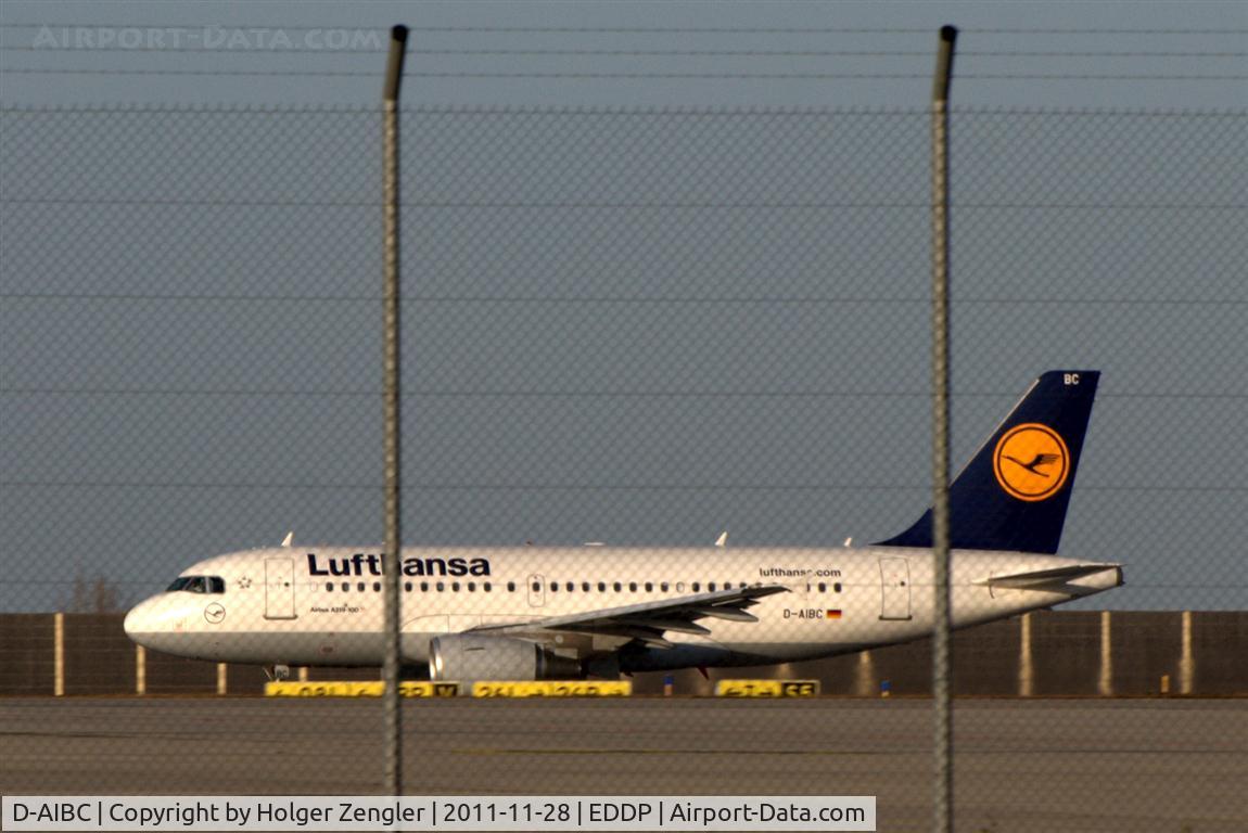 D-AIBC, 2010 Airbus A319-112 C/N 4332, View thru the fence over apron of DHL Air Hub Leipzig.