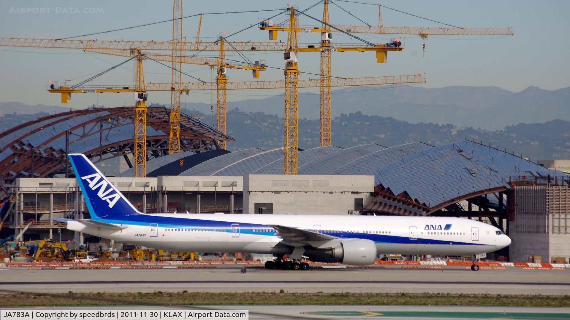 JA783A, 2008 Boeing 777-381/ER C/N 27940, All Nippon Airways holding in front of Tom Bradley Int'l Terminal undergoing renovations.