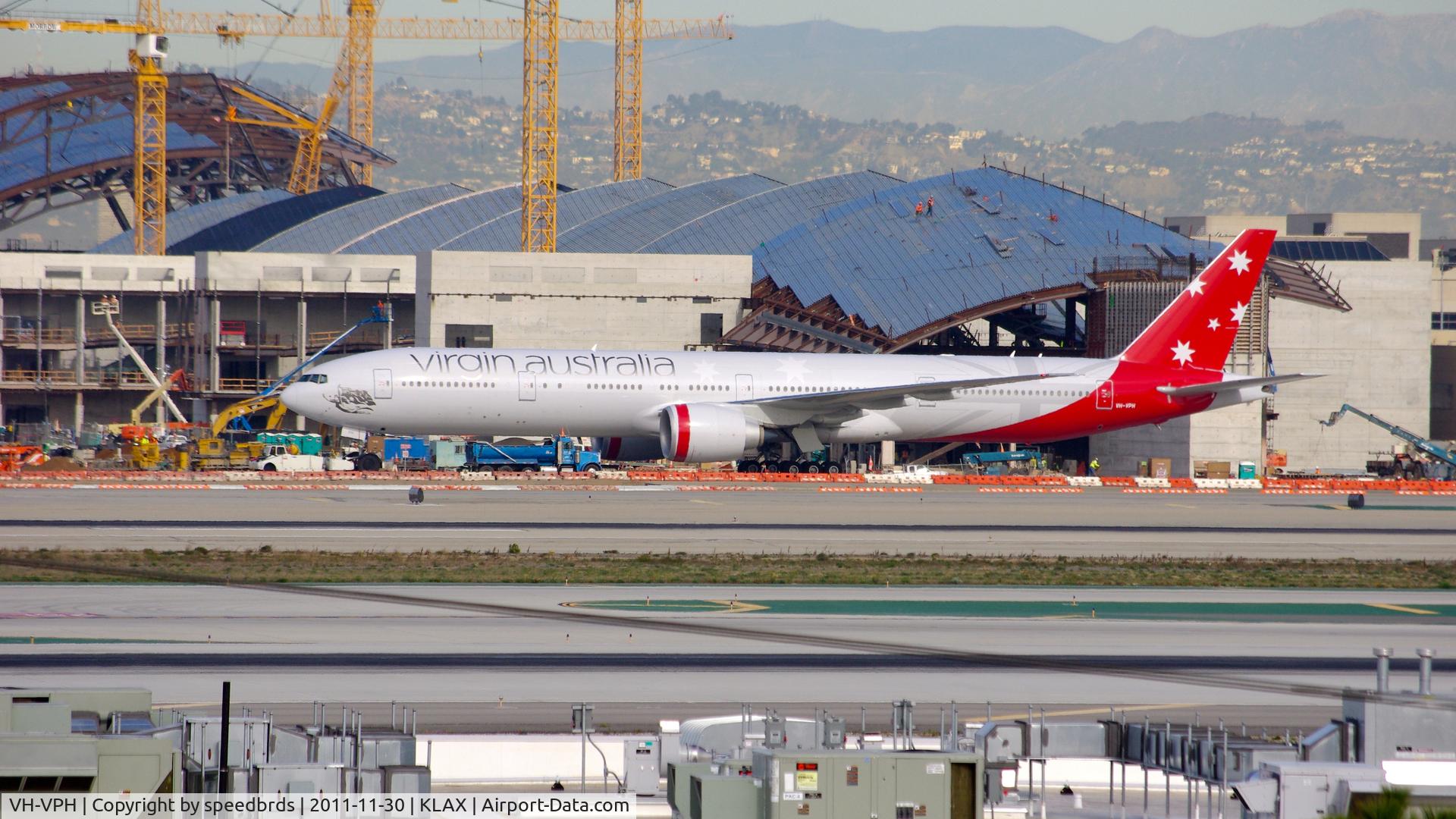 VH-VPH, 2010 Boeing 777-3ZG/ER C/N 37943, Virgin Australia being towed to remote parking for its late departure.