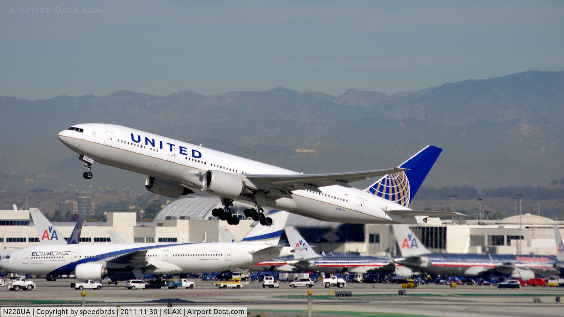 N220UA, 2001 Boeing 777-222 C/N 30223, United Airlines with new livery along with El Al B772 in the background and the 