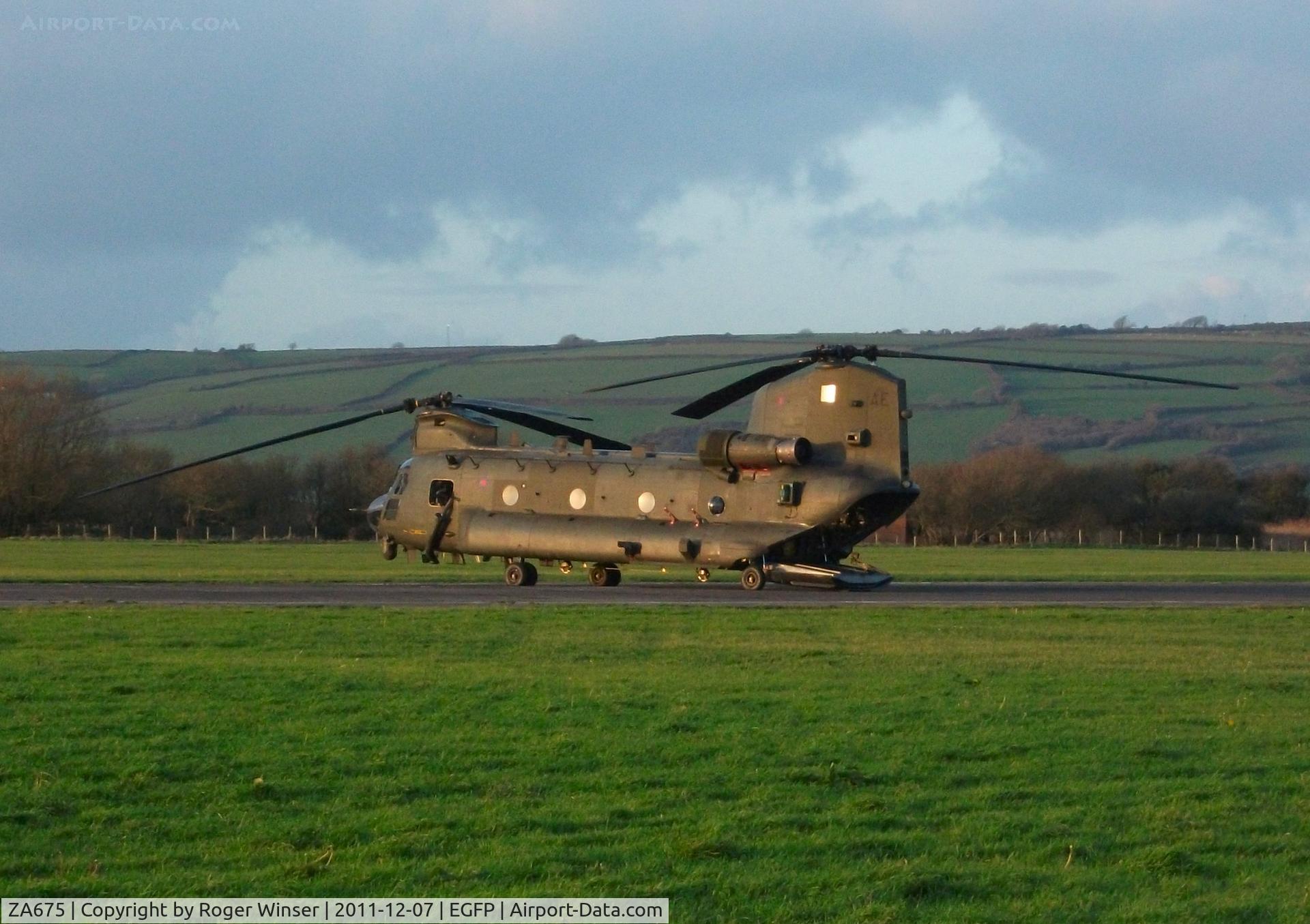 ZA675, Boeing Vertol Chinook HC.2 C/N M/A006/B-822/M7009, Coded AE of 7 Squadron RAF. The Chinook helicopter is lit by the low winter sun and had been operating on the adjacent RAF Pembrey Sands Air Weapons Range (EGOP).