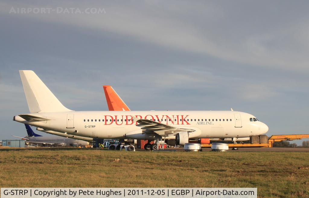 G-STRP, 1990 Airbus A320-211 C/N 136, G-STRP in the winter sunshine at Kemble undergoing parts recovery at the end of its service life.