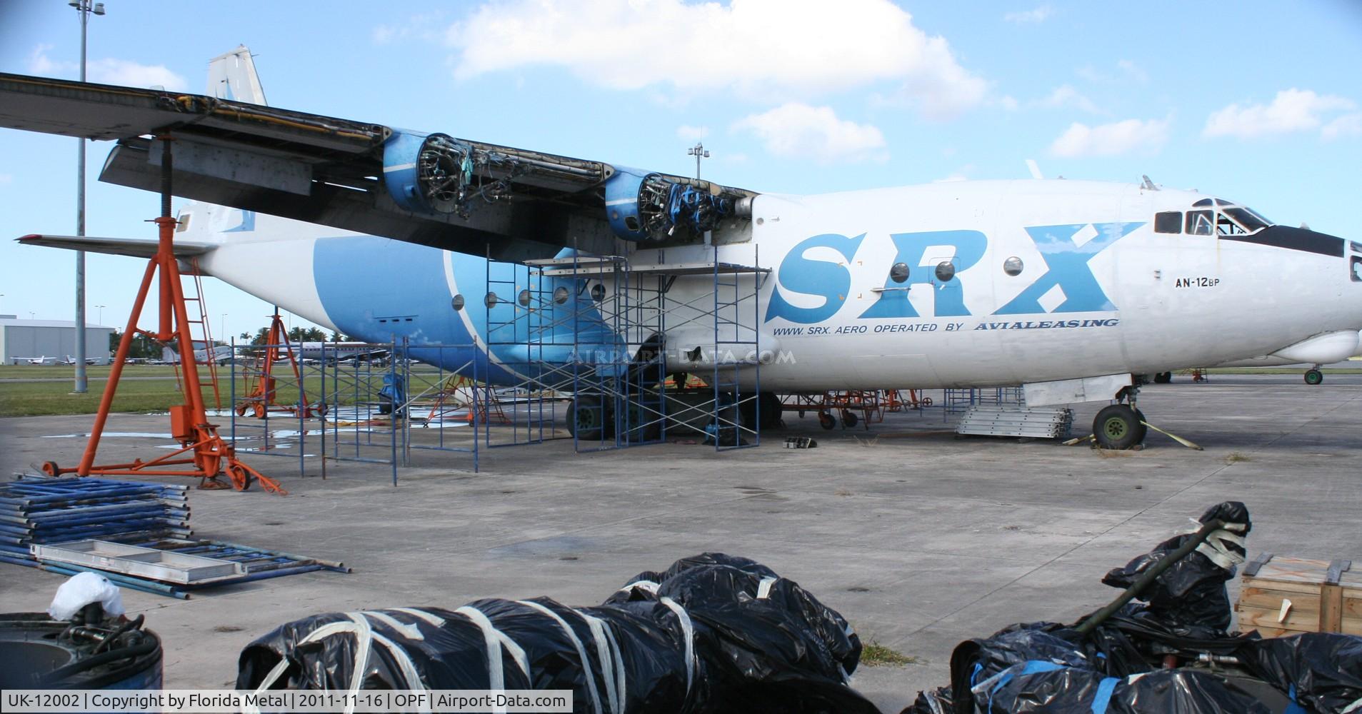 UK-12002, Antonov An-12BP C/N 402002, AN-12 being worked on