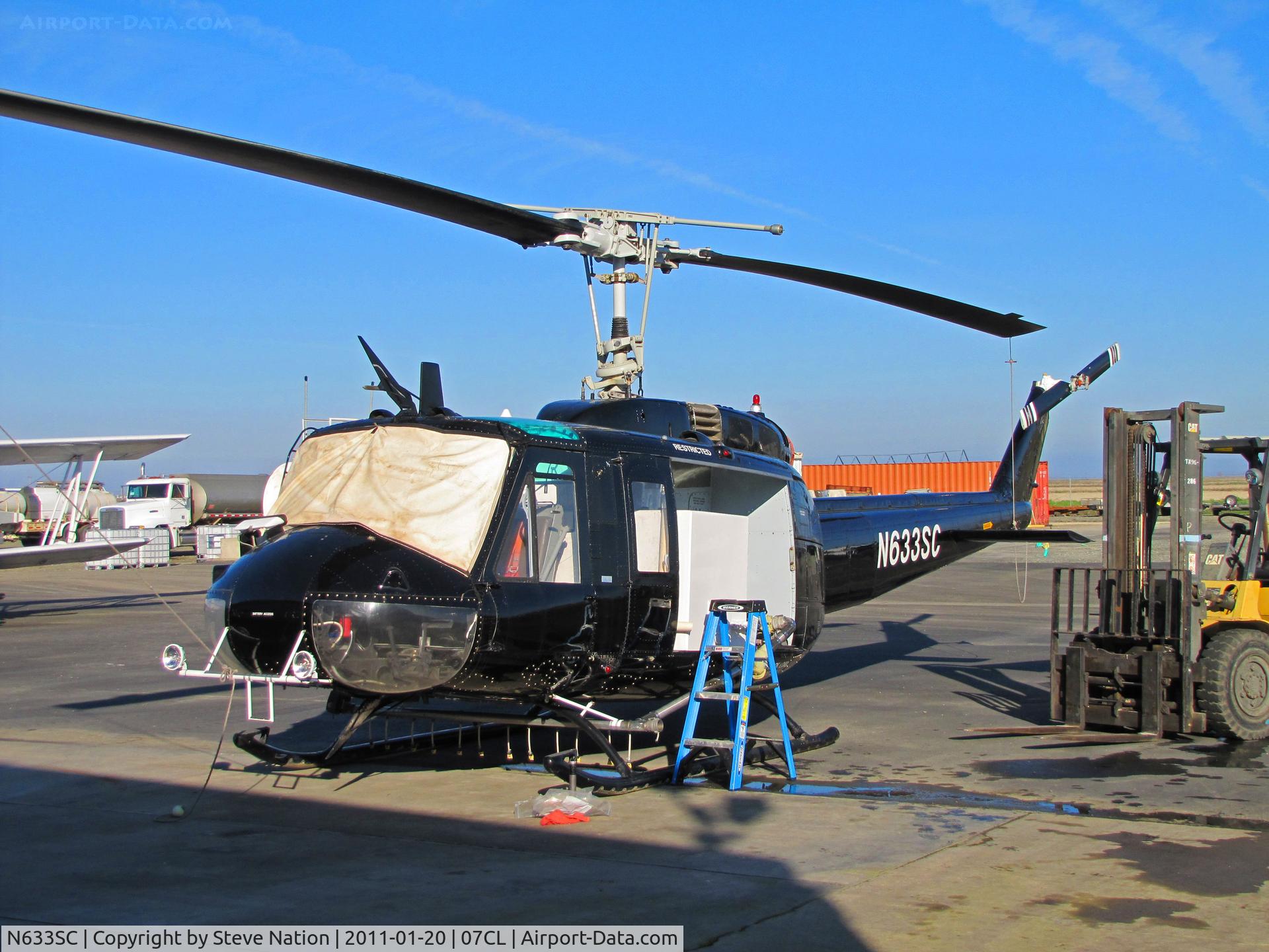 N633SC, Bell UH-1H C/N 67-17633, Recently acquired AvAg Inc (Richvale, CA) all black  UH-1H (ex 67-17633) @ operators home strip