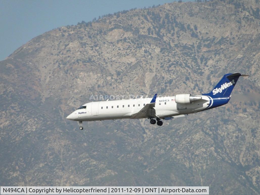 N494CA, 2003 Bombardier CRJ-200ER (CL-600-2B19) C/N 7765, On final for runway 26