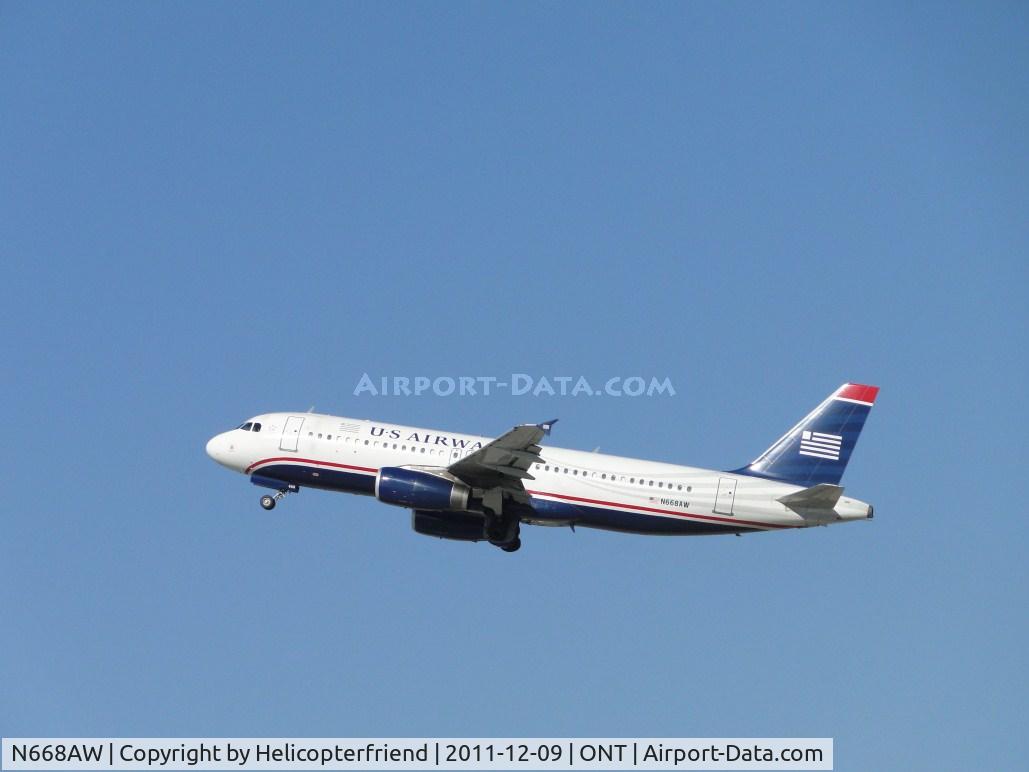 N668AW, 2002 Airbus A320-232 C/N 1764, Received passengers and is now headed westbound from runway 26R