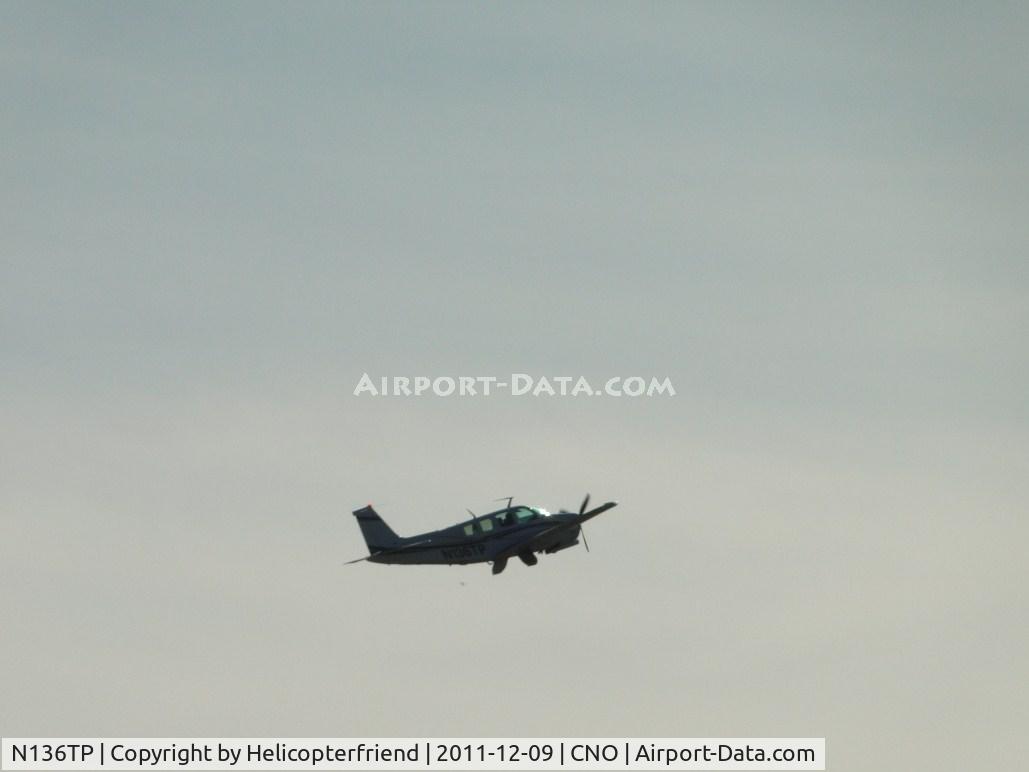 N136TP, 1977 Beech A36 Bonanza 36 C/N E-1176, Taking off from runway 26R wheels retracted and doors shutting
