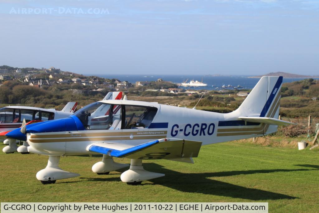 G-CGRO, 1995 Robin DR-400-140B Major C/N 2272, G-CGRO, one of a flight of three DR400s visiting St Marys Isles of Scilly - view across Hugh Town to the Scillonian at the quay
