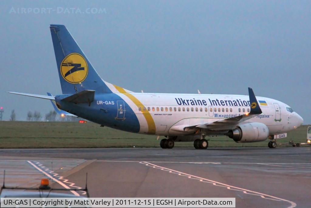 UR-GAS, 1993 Boeing 737-528 C/N 25236, Being towed to Air Livery for spray after the sun had set.