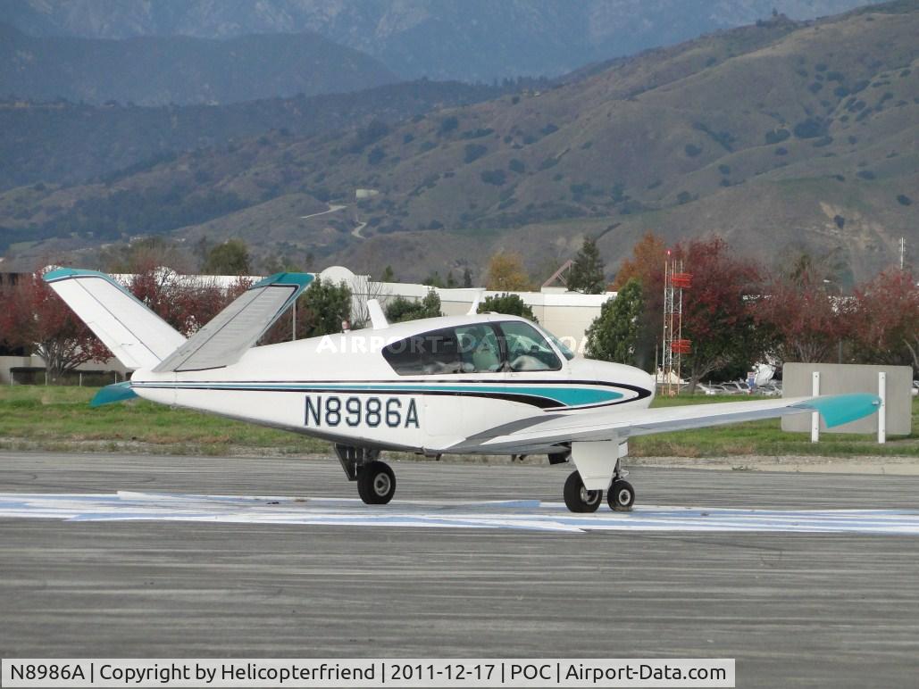 N8986A, 1951 Beech C35 Bonanza C/N D-2738, Taxiing east towards runway 26L