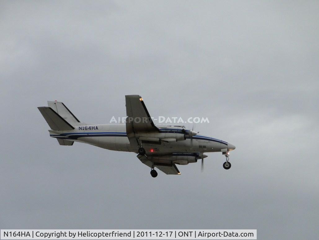N164HA, 1968 Beech 99 C/N U-60, Passing over the threshold for landing on runway 8R