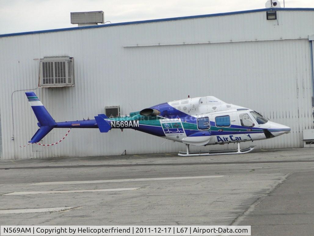 N569AM, 1988 Bell 222U C/N 47569, Looks like she's hunkered down trying to keep out of the wind with no tail or main rotors