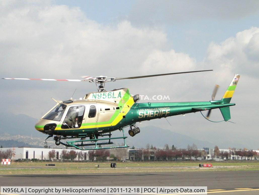 N956LA, 2010 Eurocopter AS-350B-2 Ecureuil Ecureuil C/N 7047, Heading west over taxiway Sierra, staying low until reaching static display area