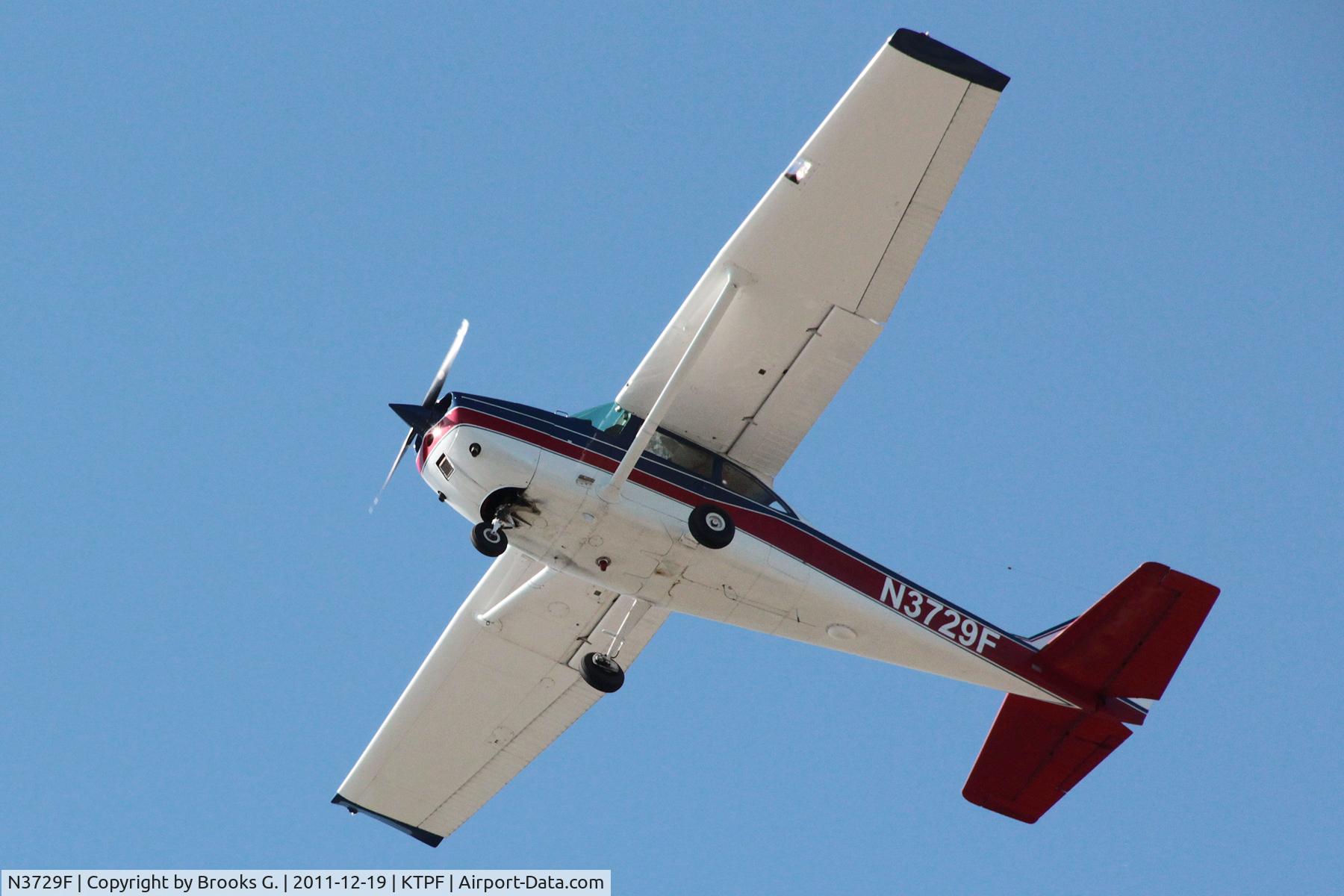 N3729F, 1966 Cessna 172H C/N 17255224, I captured this shot on 12/19/2011 experimenting with my new Canon T3i (D600) with 18mm-135mm lens as plane departed from KTPF around 2:15pm. (Shutter speed at 1/2,000, F8, ISO 800)